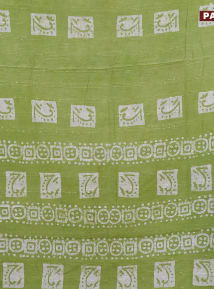 Batik cotton saree light green with allover sequin work & batik butta prints and printed lace work border