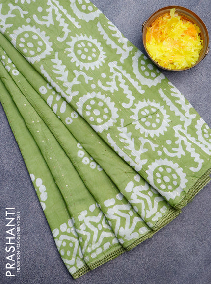 Batik cotton saree green with allover sequin work & batik butta prints and printed lace work border