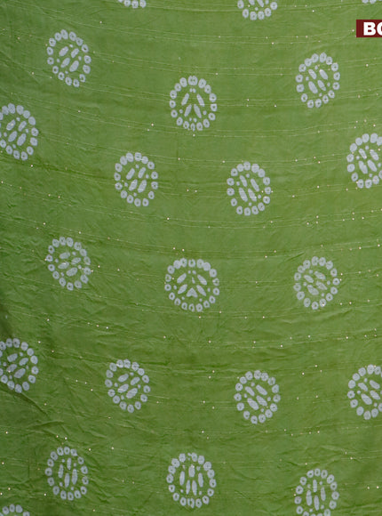 Batik cotton saree green with allover sequin work & batik butta prints and printed lace work border