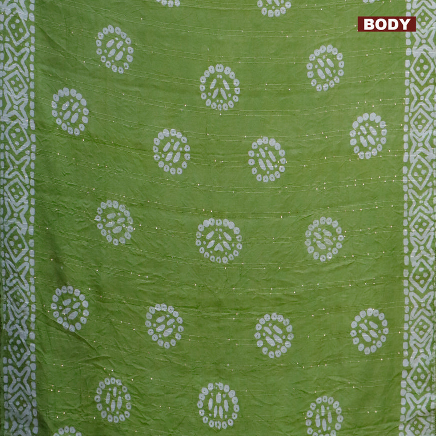 Batik cotton saree green with allover sequin work & batik butta prints and printed lace work border