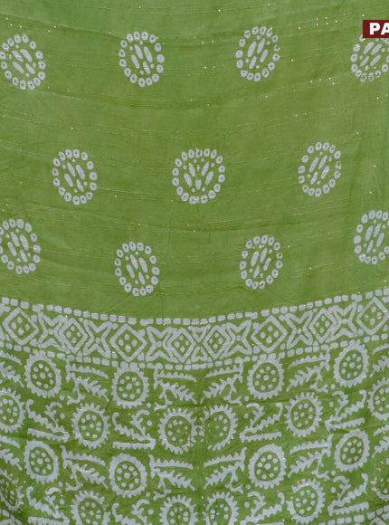 Batik cotton saree green with allover sequin work & batik butta prints and printed lace work border