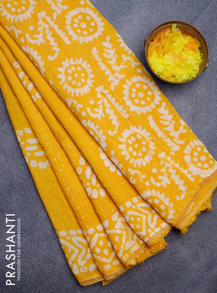 Batik cotton saree yellow with allover sequin work & batik butta prints and printed lace work border