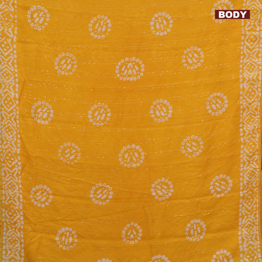 Batik cotton saree yellow with allover sequin work & batik butta prints and printed lace work border