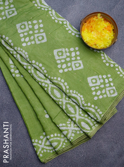 Batik cotton saree light green with allover sequin work & batik butta prints and printed lace work border