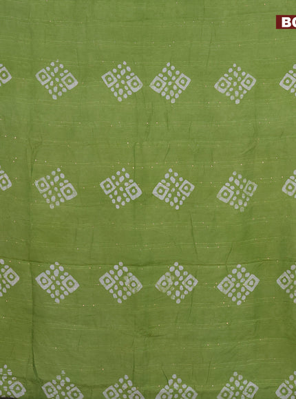 Batik cotton saree light green with allover sequin work & batik butta prints and printed lace work border