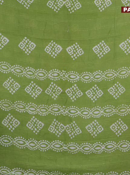 Batik cotton saree light green with allover sequin work & batik butta prints and printed lace work border