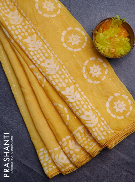 Batik cotton saree yellow with allover sequin work & batik butta prints and printed lace work border