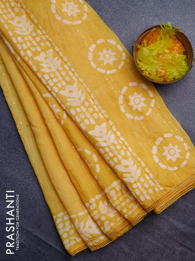 Batik cotton saree yellow with allover sequin work & batik butta prints and printed lace work border