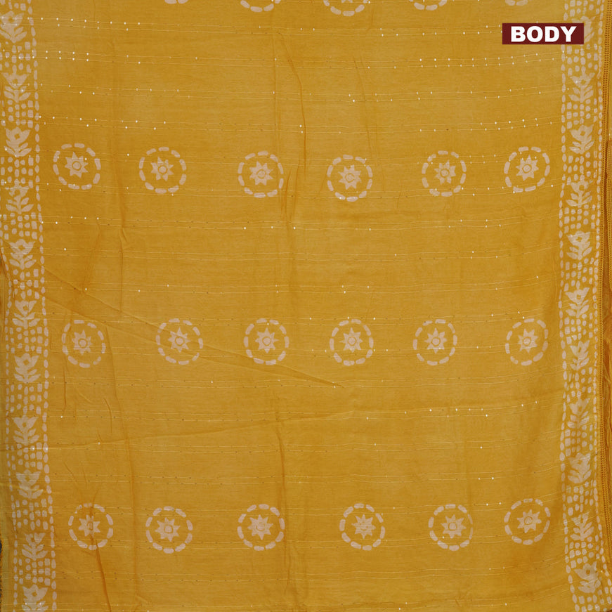 Batik cotton saree yellow with allover sequin work & batik butta prints and printed lace work border