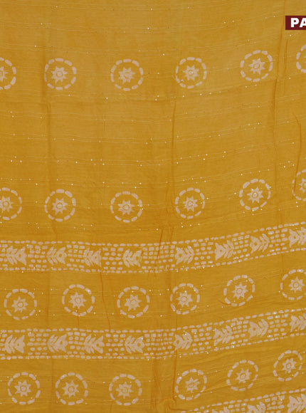 Batik cotton saree yellow with allover sequin work & batik butta prints and printed lace work border