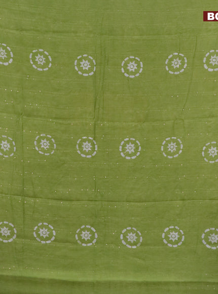 Batik cotton saree light green with allover sequin work & batik butta prints and printed lace work border