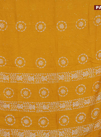 Batik cotton saree mustard yellow with allover sequin work & batik butta prints and printed lace work border