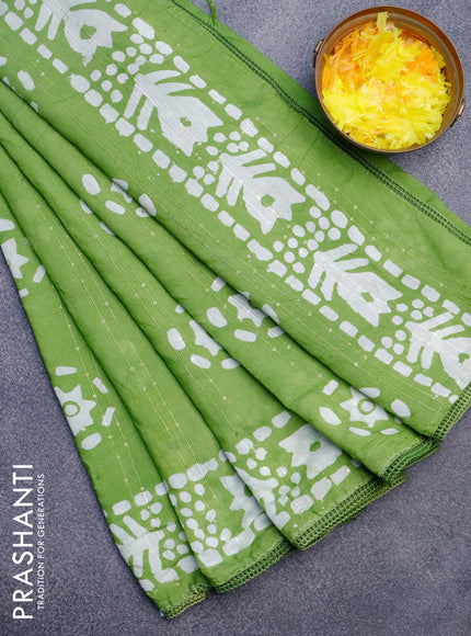 Batik cotton saree light green with allover sequin work & batik butta prints and printed lace work border