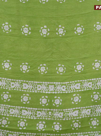 Batik cotton saree light green with allover sequin work & batik butta prints and printed lace work border