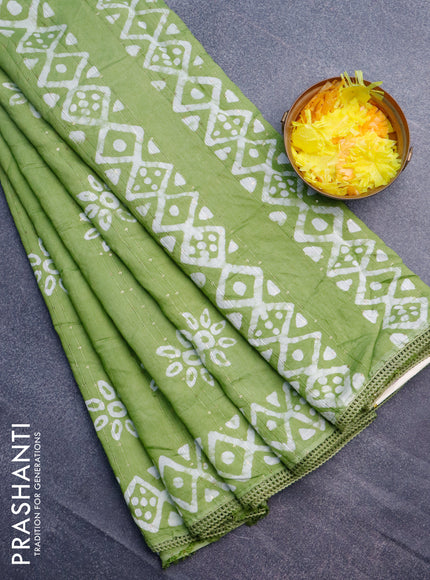 Batik cotton saree light green with allover sequin work & batik butta prints and printed lace work border