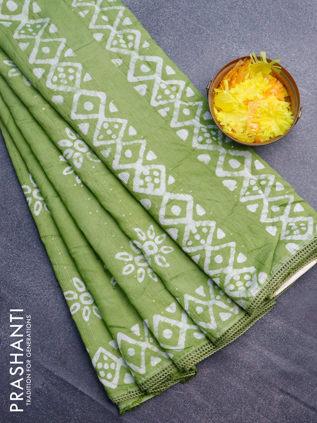 Batik cotton saree light green with allover sequin work & batik butta prints and printed lace work border