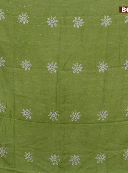 Batik cotton saree light green with allover sequin work & batik butta prints and printed lace work border