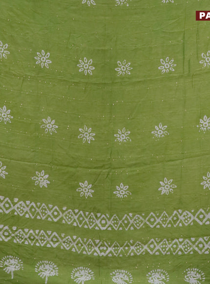 Batik cotton saree light green with allover sequin work & batik butta prints and printed lace work border