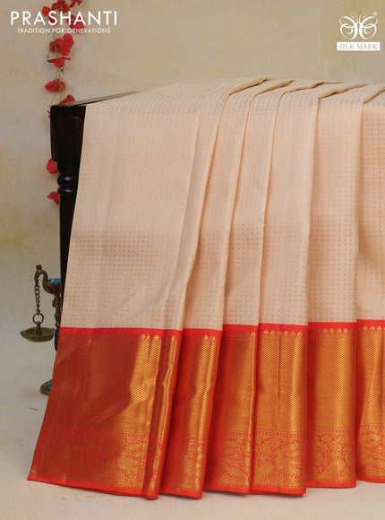 Pure kanchipuram silk saree cream and orange with allover zari woven butta weaves and long rich zari woven korvai border