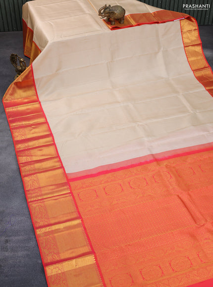 Pure kanchipuram silk saree cream and orange with allover zari woven butta weaves and long rich zari woven korvai border