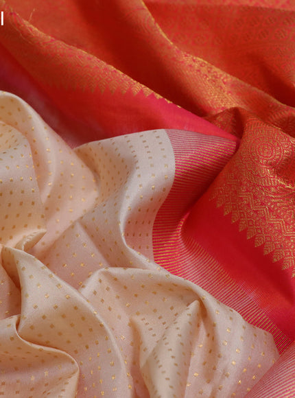 Pure kanchipuram silk saree cream and orange with allover zari woven butta weaves and long rich zari woven korvai border