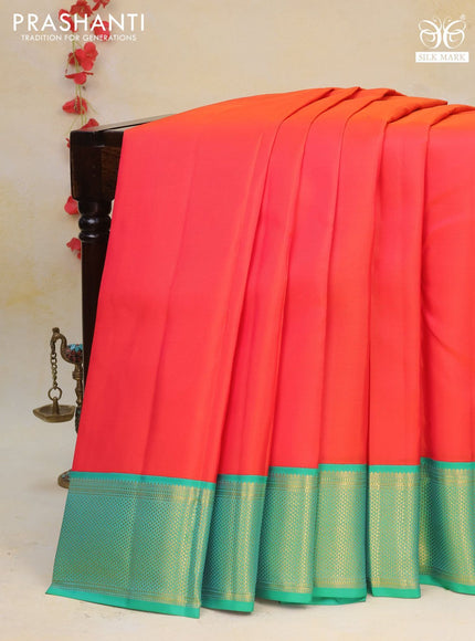 Pure kanchipuram silk saree dual shade of orange and green with plain body and zari woven border