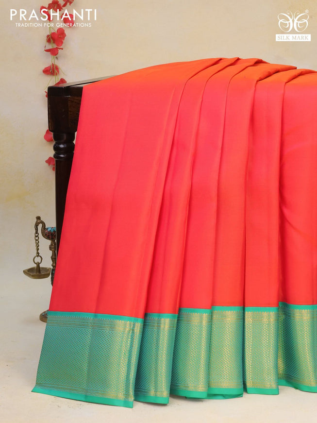 Pure kanchipuram silk saree dual shade of orange and green with plain body and zari woven border