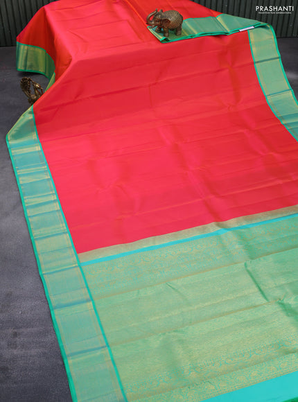 Pure kanchipuram silk saree dual shade of orange and green with plain body and zari woven border