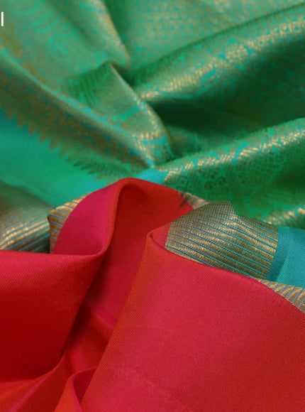 Pure kanchipuram silk saree dual shade of orange and green with plain body and zari woven border