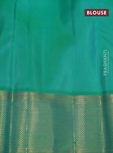 Pure kanchipuram silk saree dual shade of orange and green with plain body and zari woven border