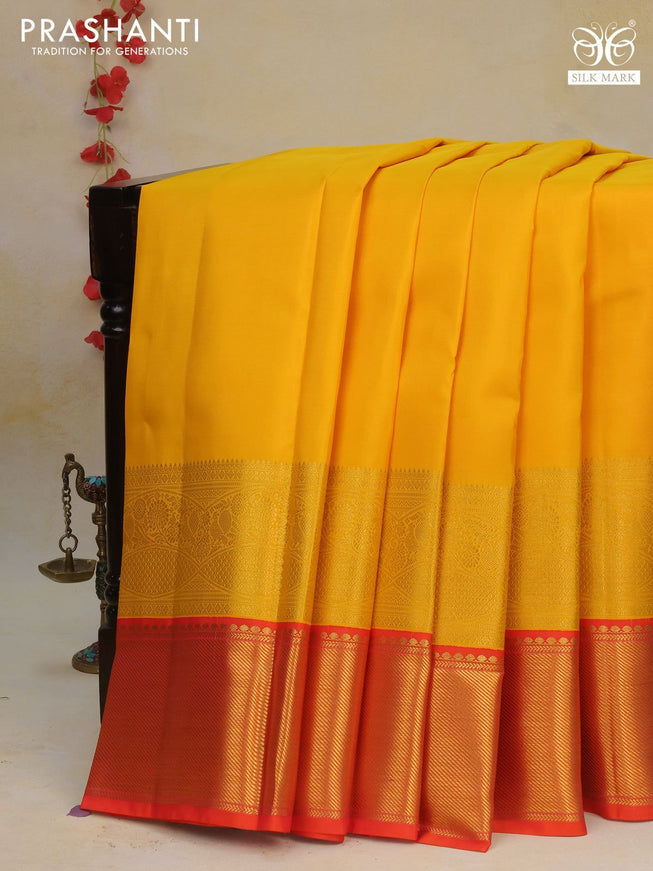 Pure kanchipuram silk saree mango yellow and dual shade of pinkish orange with plain body and long rich zari woven korvai border