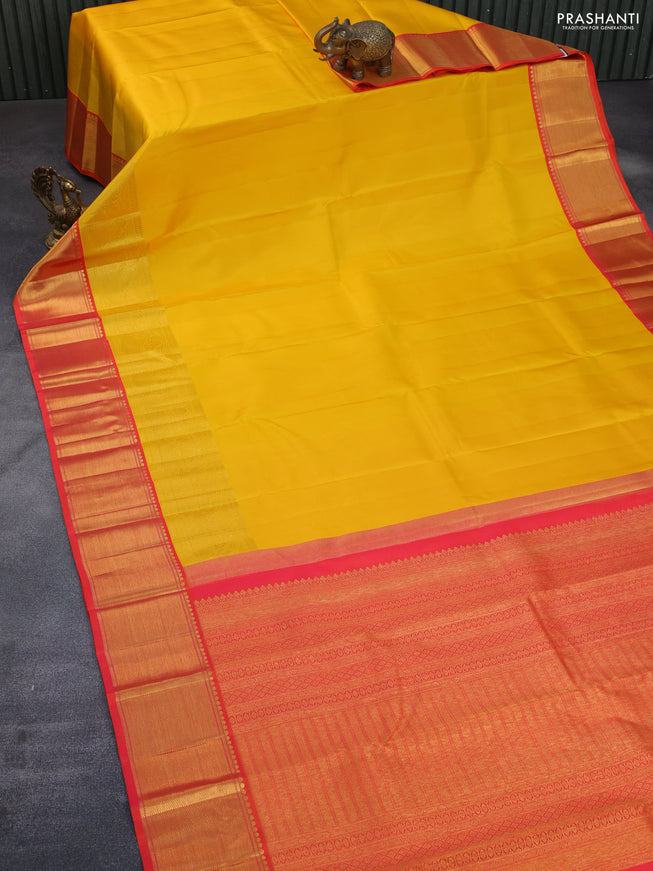 Pure kanchipuram silk saree mango yellow and dual shade of pinkish orange with plain body and long rich zari woven korvai border