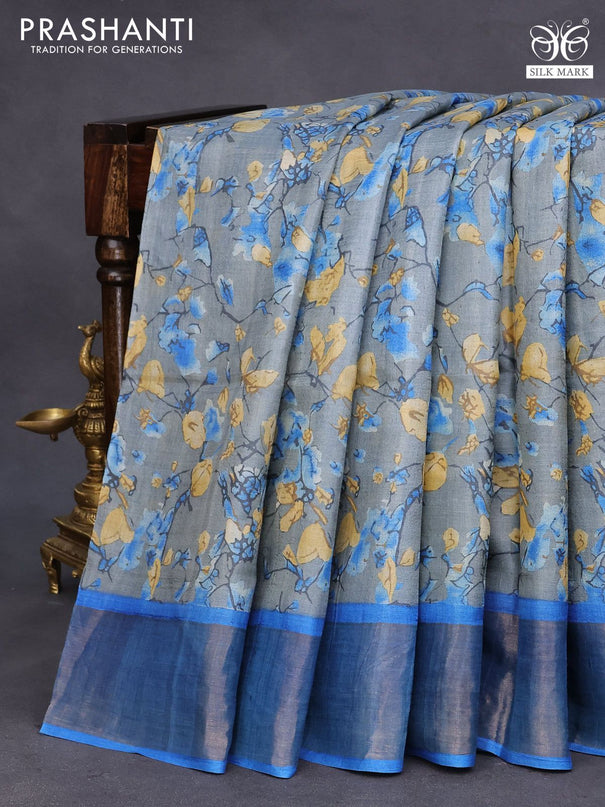 Pure tussar silk saree grey and cs blue with allover prints and zari woven border