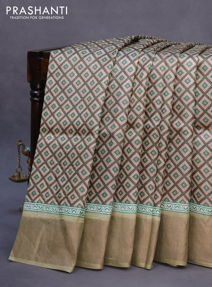 Pure tussar silk saree beige and elaichi green with allover prints and zari woven border