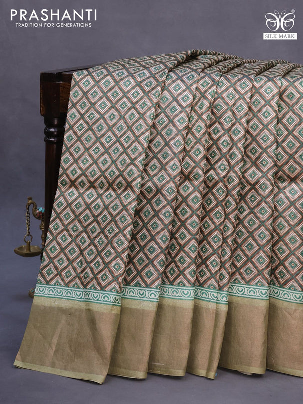 Pure tussar silk saree beige and elaichi green with allover prints and zari woven border