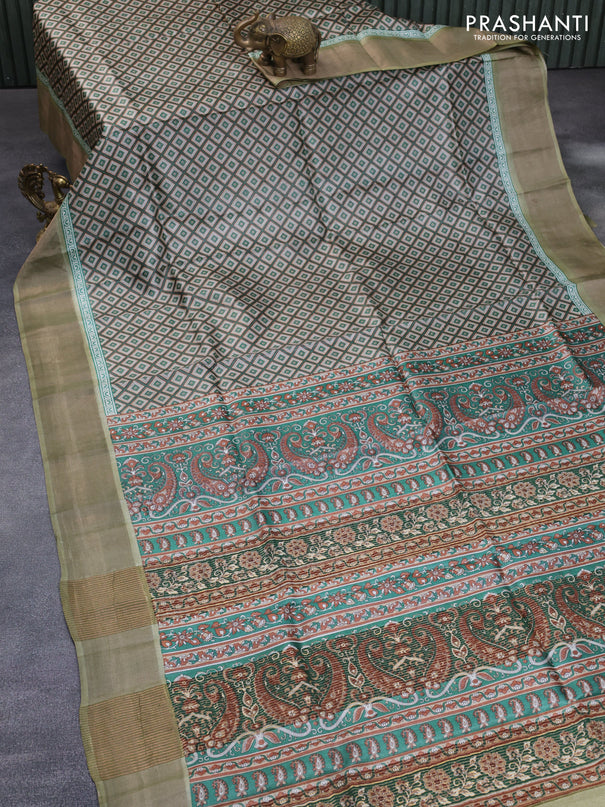 Pure tussar silk saree beige and elaichi green with allover prints and zari woven border