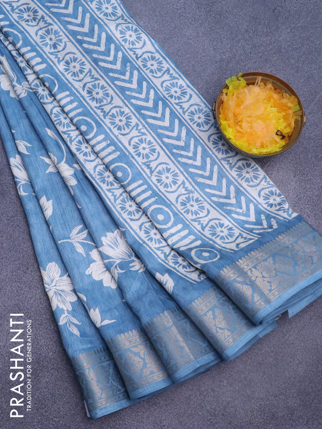 Semi dola saree blue shade with allover floral prints & self emboss and zari woven border