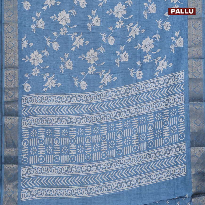 Semi dola saree blue shade with allover floral prints & self emboss and zari woven border