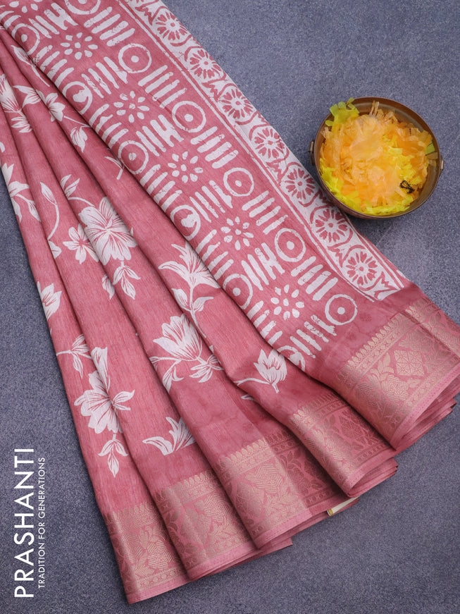 Semi dola saree peach shade with allover floral prints & self emboss and zari woven border