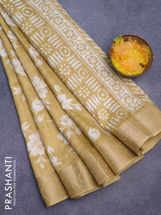 Semi dola saree yellow with allover floral prints & self emboss and zari woven border