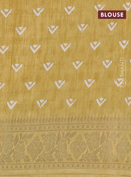 Semi dola saree yellow with allover floral prints & self emboss and zari woven border