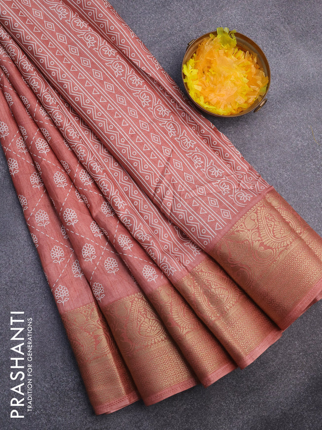 Semi dola saree peach shade with allover floral prints and zari woven border