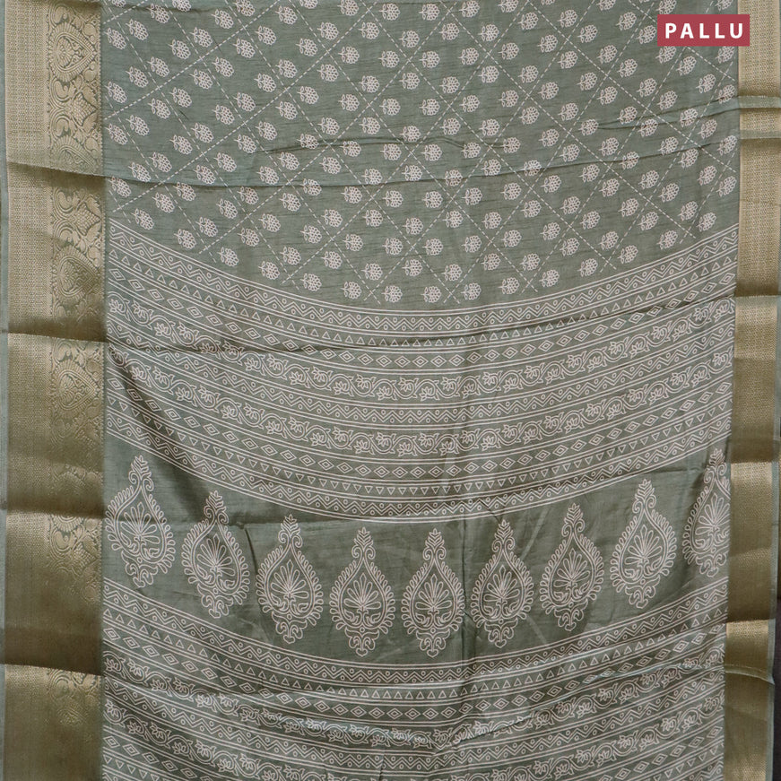 Semi dola saree pastel green with allover floral prints and zari woven border