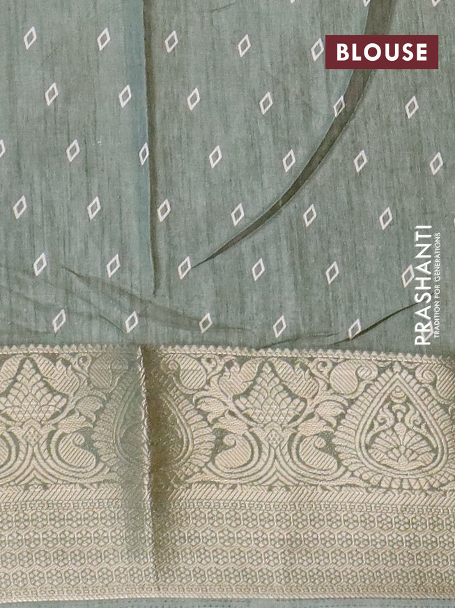 Semi dola saree pastel green with allover floral prints and zari woven border