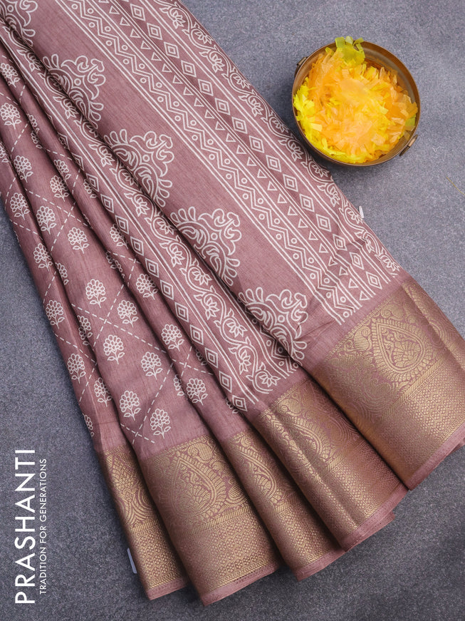 Semi dola saree pastel brown shade with allover floral prints and zari woven border