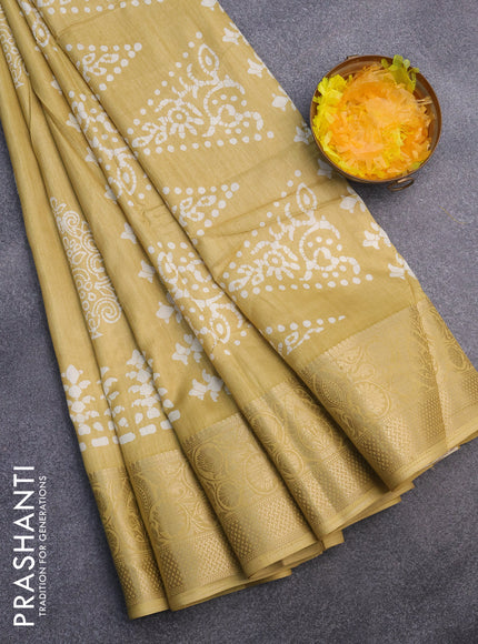 Semi dola saree yellow with butta prints and zari woven border