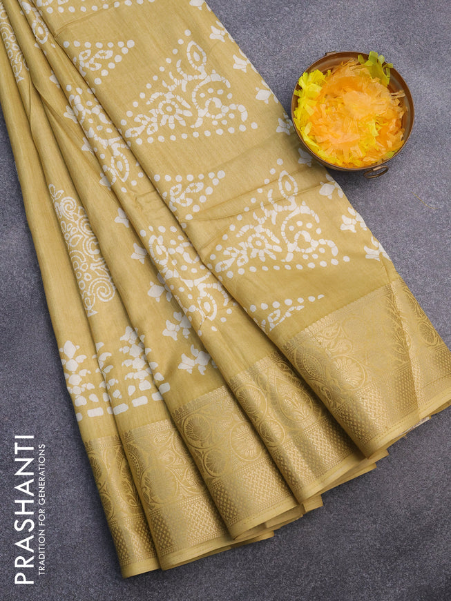 Semi dola saree yellow with butta prints and zari woven border