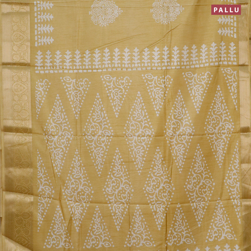 Semi dola saree yellow with butta prints and zari woven border