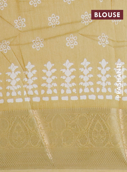 Semi dola saree yellow with butta prints and zari woven border