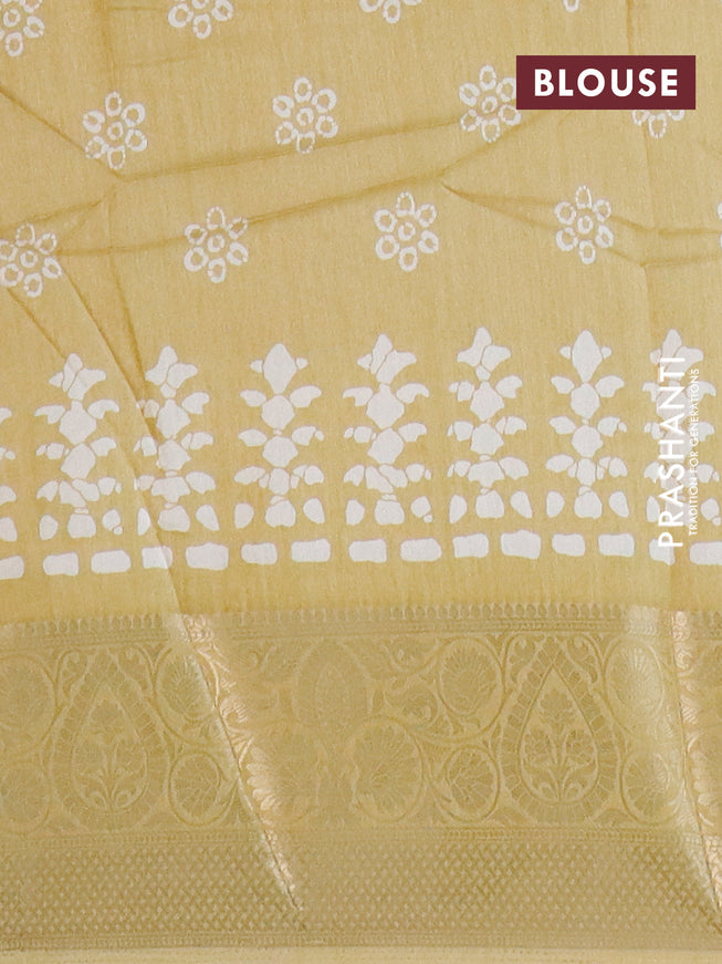 Semi dola saree yellow with butta prints and zari woven border